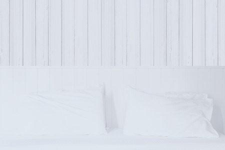 Interior modern white bedroom decoration with retro white wooden backgroundの写真素材