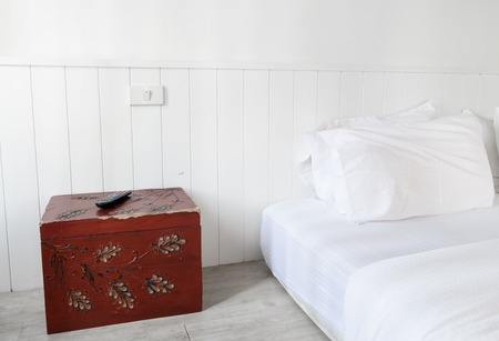 Modern white bedroom interior decoration with red box side background