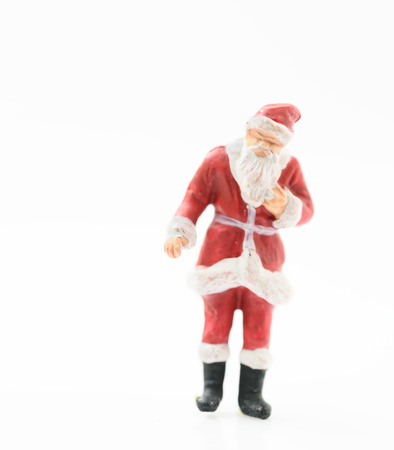 Miniature santa claus on white backgroundの写真素材