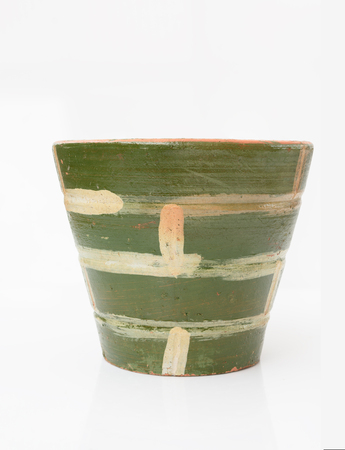 Clay flowerpot with green colour design isolated on white backgroundの写真素材