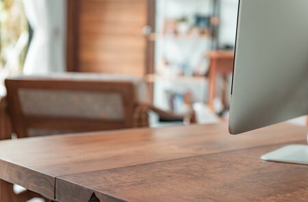 Work from home office gadget computer on wooden desk in modern living roomの写真素材