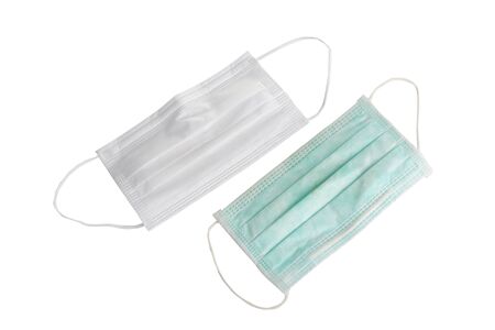 Green surgical used masks isolated on white backgroundの写真素材