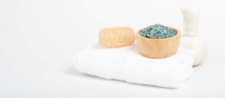Spa massage with herb pressure ball,scrub and white towels  on white background