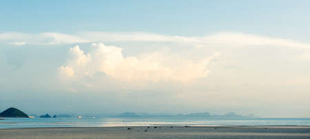 Summer seascape bright blue sea sky white clouds backgroundの写真素材