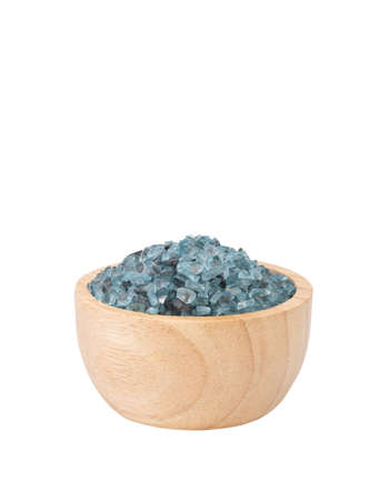Blue crystal salt in wood bowl isolated on white backgroundの写真素材