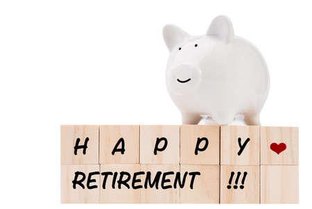 Wood cubes and piggy bank isolated on white background saving money for good life retirement conceptの写真素材