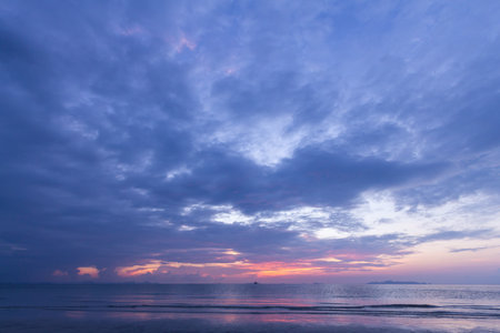 Beautiful tropical purple beach sunset with colourful sea skyの写真素材