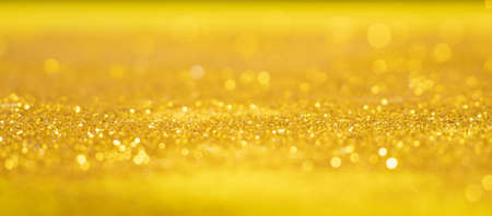 Gold glitter  wallpaper textured for Christmas or New year or festival background,Abstract defocused bokeh lights backgroundの写真素材