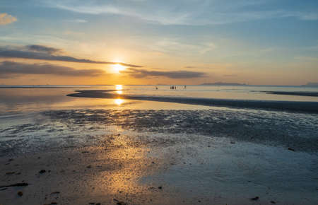 Beautiful tropical beach sunset with colourful sea skyの写真素材
