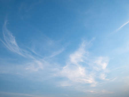 Bright blue sky pluffy white clouds sunrise wallpaper backgroundの写真素材