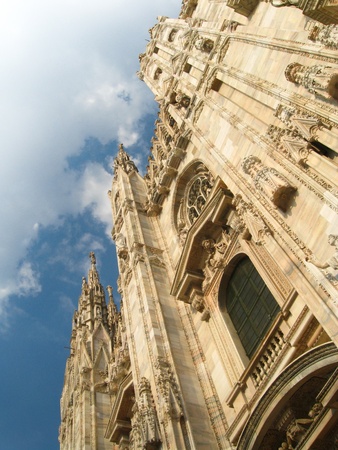 Looking up at the facade of the gothic duomo (cathedral)  in Milan Italyの写真素材