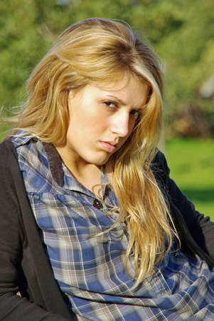 Portrait of an angry blonde teenager