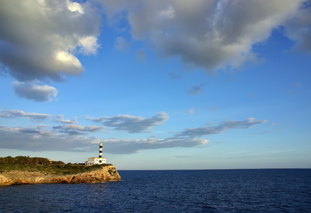 Typical mediterranean lighthouse in Porto Colom (Majorca - Spain)の写真素材