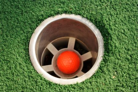 A hole at a miniature golf courseの写真素材