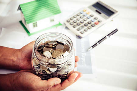 Money saving for house in the glass bottle, business home concept