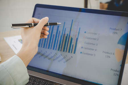 Businesswoman looking at laptop screen, spreadsheets, graph financial development, bank accounts,...