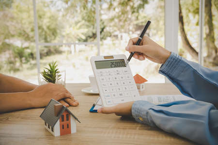 Salesman person and customer home buyer had achieve target means togetherの写真素材