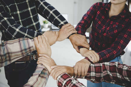 group of like-minded people cupping their palms togetherの写真素材