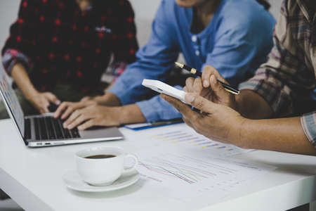 Business people group looking at charts, spreadsheets, graph financial development, bank accounts, statistics, economy, data analysis, investment analysis, stock exchangeの写真素材