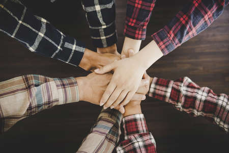 group of like-minded people cupping their palms togetherの写真素材