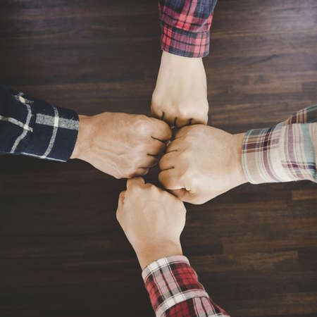 group of like-minded people cupping their palms togetherの写真素材