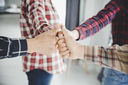 group of like-minded people cupping their palms togetherの写真素材