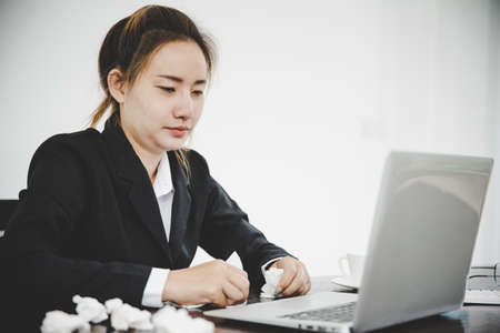 Sick young asian business woman  having cold fever and have a running nose.Health problems conceptの写真素材