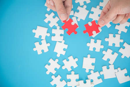 Human hands holding red jigsaw with word problem solution. symbol of association and connection....