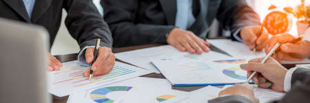 Banner of Group professional business people person working together analyze in office, work together to discuss company financial statistics report, brainstorm ideas graph datum documents on table.の写真素材