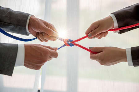 Teamwork businessman team, team people hold rope partnership, cooperation, concept.の写真素材