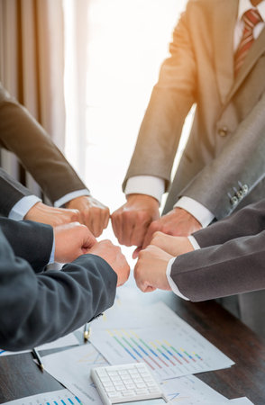 Close-up of group hand success business people person working together in office. Diversity of businessman and businesswoman attending corporate meetings. concept of friendship, cooperation corporate.の写真素材