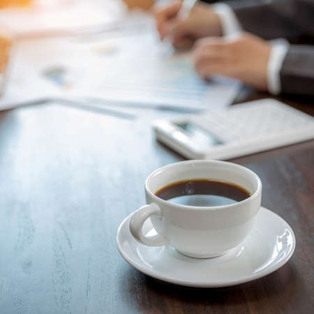 Group professional business people person working together to analyze in office, work together to discuss company financial statistics report, brainstorm ideas, and graph datum documents on the table.の写真素材