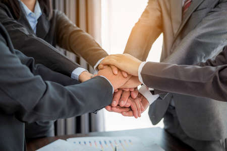 Close-up of group hand success business people person working together in office. Diversity of businessman and businesswoman attending corporate meetings. concept of friendship, cooperation corporate.の写真素材