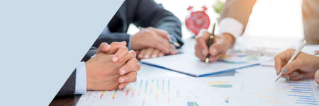 Banner of Group professional business people person working together analyze in office, work together to discuss company financial statistics report, brainstorm ideas graph datum documents on table.の写真素材