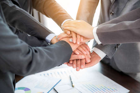 Close-up of group hand success business people person working together in office. Diversity of...