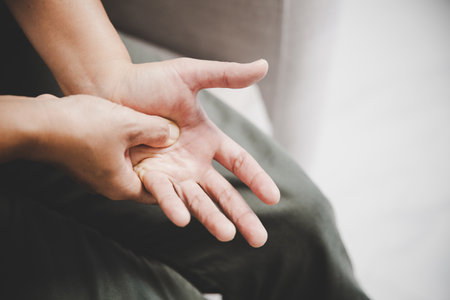 Arthritis person, finger woman ache from working in office. Concept office syndrome hand pain from occupational disease, woman having wrist pain from using laptop computer, wrist pain.の写真素材