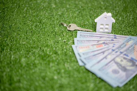 house property mortgage with cash money dollar bill on table concept of business finance, saving for buy home, investment loan, american currency, sale estate, bank payment, sell-rent real estateの写真素材