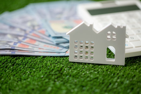 house property mortgage with cash money dollar bill on table concept of business finance, saving for buy home, investment loan, american currency, sale estate, bank payment, sell-rent real estateの写真素材