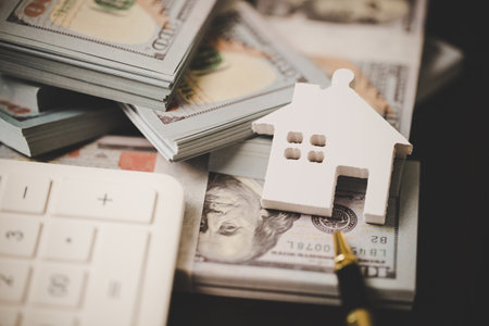house property mortgage with cash money dollar bill on table concept of business finance, saving for buy home, investment loan, american currency, sale estate, bank payment, sell-rent real estateの写真素材