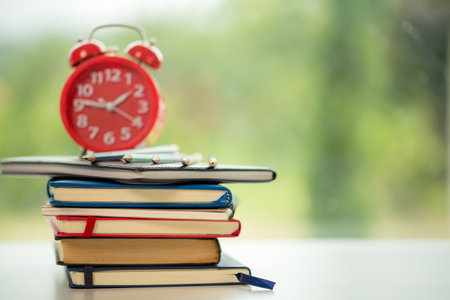 Object education green nature background with stack of ancient books or old bible, open paper book on wooden table with copy space. concept of back to school, research studyの写真素材