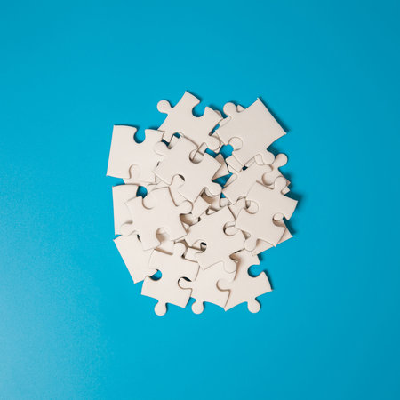 White part of jigsaw puzzle pieces on blue background. concepts of problem solving, business success, teamwork, Team playing jigsaw game incomplete, Texture photo with copy space for textの写真素材