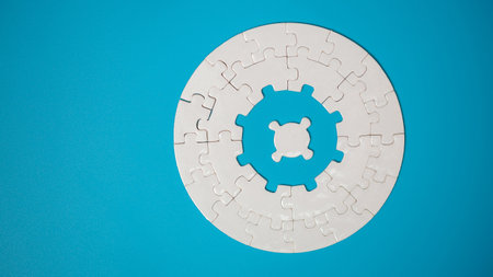 White part of jigsaw puzzle pieces on blue background. concepts of problem solving, business success, teamwork, Team playing jigsaw game incomplete, Texture photo with copy space for textの写真素材