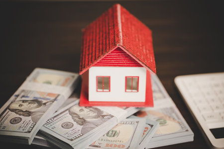 house property mortgage with cash money dollar bill on table concept of business finance, saving for buy home, investment loan, american currency, sale estate, bank payment, sell-rent real estateの写真素材