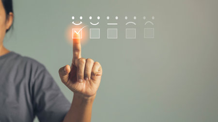 Customer service and Satisfaction concept, Business person are touching the virtual screen on happy Smiley face icon to give satisfaction in service. rating very impressed. customer service feedback.の写真素材