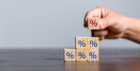 Closeup wood cubes with percentage symbol, Interest rate and dividend concept, wooden block with...