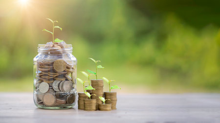 Money coin stack growing graph with glass jar saving concept. business finance and saving money investment, plant growing up on coin. Balance savings and investment. save retirement for interest ideaの写真素材