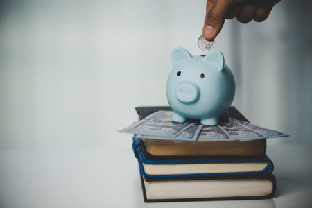 close-up education object with stack money coin-cash dollar and glass jar on background. Concept to saving money income for study, Calculating student finance costs and investment budget loanの写真素材