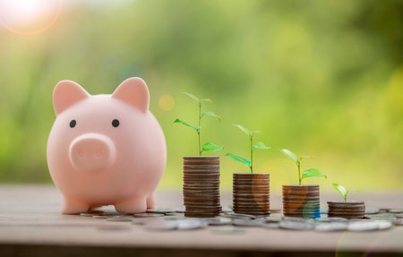 Money coin stack growing graph with piggy bank saving concept. business finance and saving money investment, plant growing up on coin. Balance savings and investment. save retirement for interest ideaの写真素材