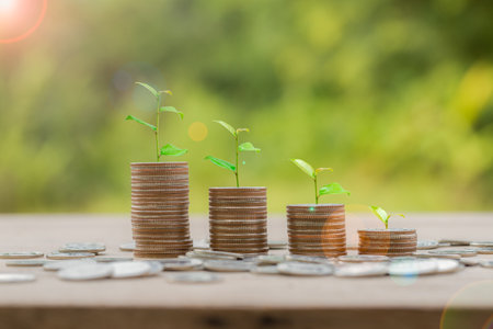 Money coin stack growing graph for saving concept. business finance and saving money investment, plant growing up on coin. Balance savings and investment. save retirement for interest ideaの写真素材