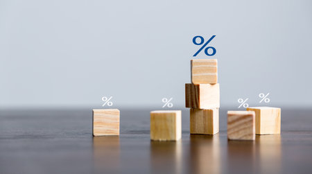 Closeup wood cubes with percentage symbol, business interest, discount investment, financial growth, interest rate increase, sale price and tax rise, future gain, market digital conceptの写真素材